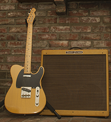 Photo of a Fender Telecaster guitar and a Fender Bassman amplifier.